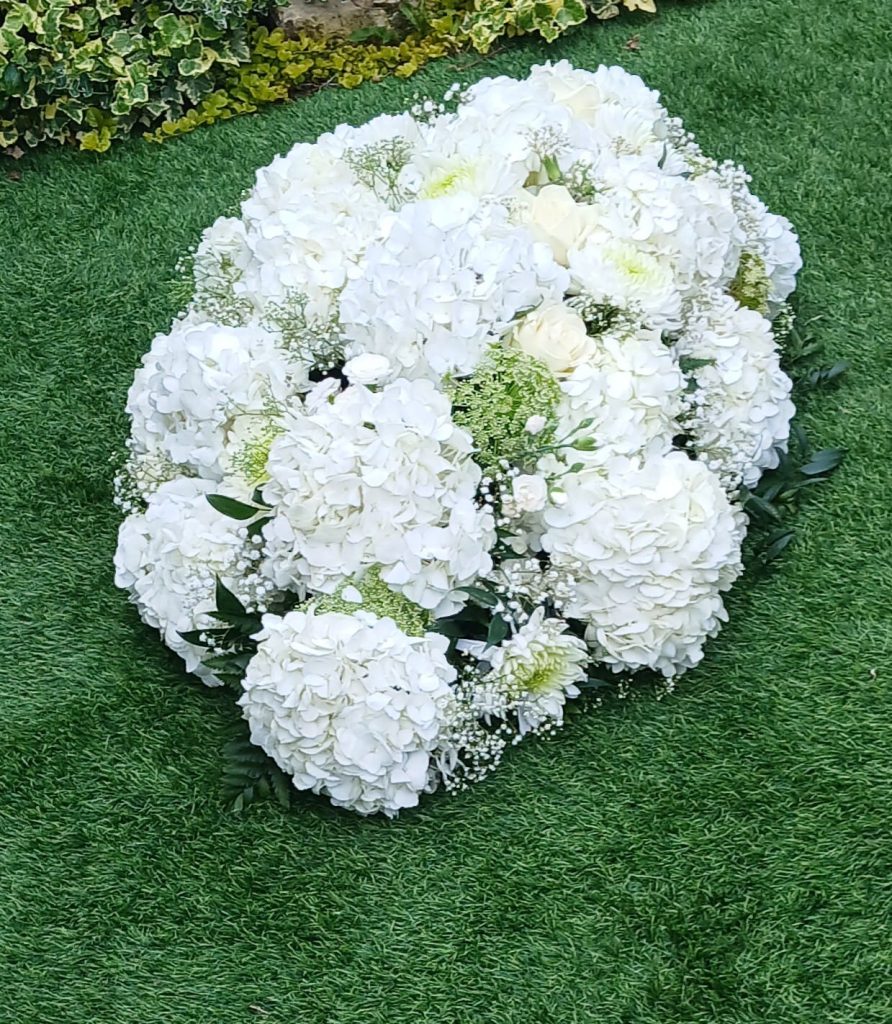 White Hydrangea Casket Spray – Elegant All-White Funeral Arrangement
