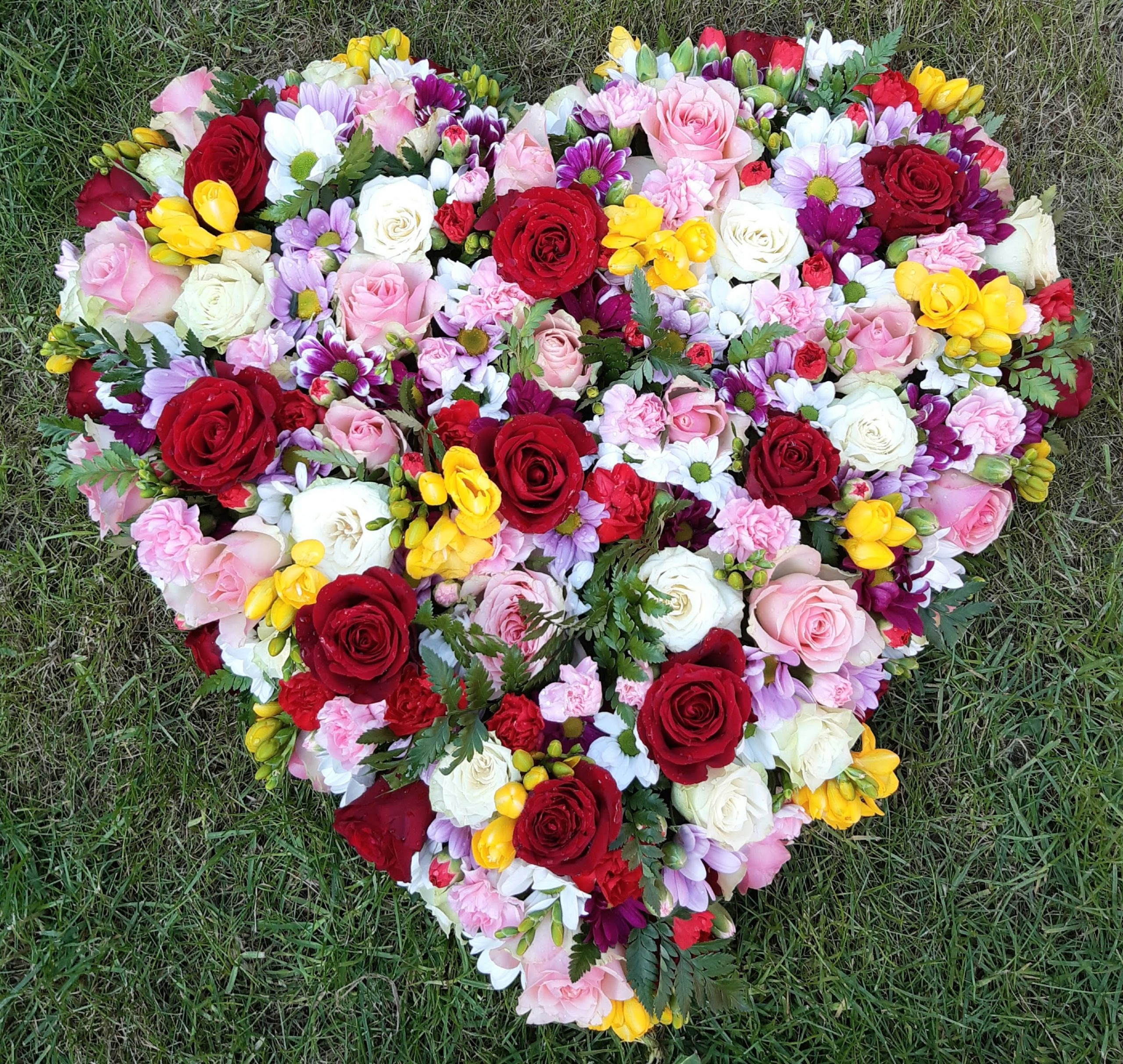 Floral Heart Tribute – Classic Heart-Shaped Funeral Arrangement